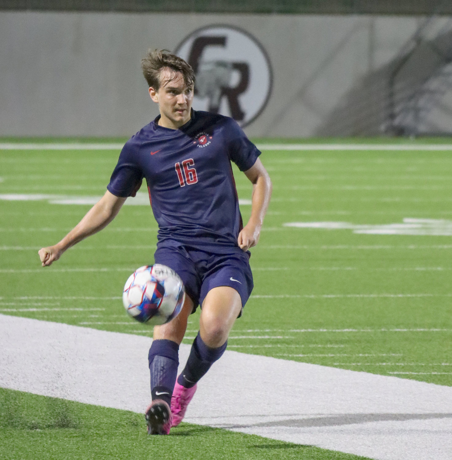 Tompkins senior Alec Shockley plays the ball downfield during Tompkins’ Class 6A Region III final against Jersey Village on Friday, April 9, at Legacy Stadium.